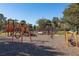 Community playground with swings, slides, a climbing structure and more is set on a mulch base at 10350 Lake District Ln # S, Orlando, FL 32832