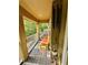 Serene porch offers a cozy retreat with its comfortable seating and peaceful ambiance at 10350 Lake District Ln # S, Orlando, FL 32832