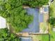 Aerial view of the backyard featuring a storage shed and trees on the property at 1046 Seminole Creek Dr, Oviedo, FL 32765