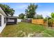 Spacious backyard featuring a screened-in porch and a storage shed at 1046 Seminole Creek Dr, Oviedo, FL 32765