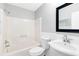 Clean bathroom featuring a shower and tub combo, a toilet, a sink, and a mirror at 1046 Seminole Creek Dr, Oviedo, FL 32765