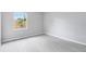 Bright bedroom with neutral paint, sleek floors, and a large window for natural light at 1046 Seminole Creek Dr, Oviedo, FL 32765