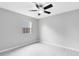Bright bedroom with a ceiling fan, window view, and sleek floors at 1046 Seminole Creek Dr, Oviedo, FL 32765