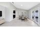 Bright dining room boasts sleek floors, neutral paint, and stylish table set ready for entertaining guests at 1046 Seminole Creek Dr, Oviedo, FL 32765