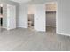 Hallway with bathroom and walk-in closet access with sleek floors and neutral paint at 1046 Seminole Creek Dr, Oviedo, FL 32765