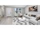 Inviting living room with contemporary decor, a patterned rug, and a view of the front yard at 1046 Seminole Creek Dr, Oviedo, FL 32765