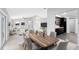 Open-concept living space with modern kitchen, dining area, and adjacent living room perfect for entertaining guests at 1046 Seminole Creek Dr, Oviedo, FL 32765