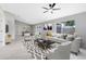 Open living room view leading to the dining area with natural light and stylish decor at 1046 Seminole Creek Dr, Oviedo, FL 32765
