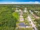 Scenic aerial view showcasing the neighborhood's lush greenery, homes, and serene surroundings at 10460 Riva Ridge Trl, Orlando, FL 32817