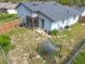 This backyard view features an enclosed patio with a well manicured yard and lush surrounding green landscape at 10460 Riva Ridge Trl, Orlando, FL 32817
