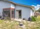 This backyard view features an enclosed patio with a well manicured yard at 10460 Riva Ridge Trl, Orlando, FL 32817