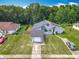 A view of the house and detached garage shows the home's curb appeal at 10460 Riva Ridge Trl, Orlando, FL 32817