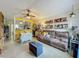 Cozy living room adjacent to kitchen with dining and comfortable seating at 10460 Riva Ridge Trl, Orlando, FL 32817