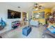 Cozy living room adjacent to kitchen with tile floors and comfortable seating at 10460 Riva Ridge Trl, Orlando, FL 32817