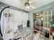 Relaxing screened in porch with ceiling fan, table, chairs and hammock at 10460 Riva Ridge Trl, Orlando, FL 32817