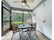 Cozy sunroom with tiled floors, outdoor access, and a peaceful view, perfect for relaxation at 10460 Riva Ridge Trl, Orlando, FL 32817