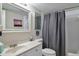 Well-lit bathroom with a combined tub and shower featuring neutral finishes at 1051 S Highland St # 5E, Mount Dora, FL 32757