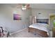 Spacious bedroom with a hardwood floor, a ceiling fan and a classic decor at 1051 S Highland St # 5E, Mount Dora, FL 32757