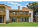 Charming multi-level condo with wooden balcony overlooking the lush, green lawn and manicured landscaping at 1051 S Highland St # 5E, Mount Dora, FL 32757