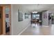 The living room features hardwood floors and an entrance to a bedroom and a balcony at 1051 S Highland St # 5E, Mount Dora, FL 32757
