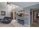 The living room features hardwood floors, a breakfast bar, and vaulted ceilings with large windows at 1051 S Highland St # 5E, Mount Dora, FL 32757