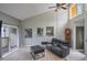 The living room features high ceilings and large windows allowing ample natural light at 1051 S Highland St # 5E, Mount Dora, FL 32757