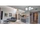 Open concept floor plan that includes a living room with a kitchen and a breakfast bar at 1051 S Highland St # 5E, Mount Dora, FL 32757