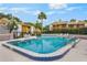 Resort-style pool with chairs, umbrellas, and lush surroundings for enjoyable outdoor living at 1051 S Highland St # 5E, Mount Dora, FL 32757