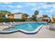 Community pool surrounded by lounge chairs, offering a relaxing oasis for residents at 1051 S Highland St # 5E, Mount Dora, FL 32757