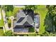 Aerial view of property showcasing pool, outdoor seating, well-manicured lawn, and solar panels on the roof at 1141 Waldorf Ct, Winter Springs, FL 32708