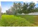 Spacious backyard featuring lush green grass and a well-maintained fence line, providing privacy at 1141 Waldorf Ct, Winter Springs, FL 32708