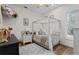 bedroom with four poster canopy bed and natural light at 1141 Waldorf Ct, Winter Springs, FL 32708