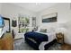Cozy bedroom with natural light, complemented by a charming landscape painting at 1141 Waldorf Ct, Winter Springs, FL 32708
