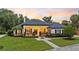 Beautiful single story home featuring manicured lawn, mature landscaping, and architectural details at 1141 Waldorf Ct, Winter Springs, FL 32708