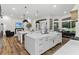 Open kitchen design with a large island, barstool seating, and seamlessly flowing living spaces at 1141 Waldorf Ct, Winter Springs, FL 32708