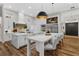 Modern kitchen boasts custom white cabinetry, stainless steel appliances, and pendant lighting at 1141 Waldorf Ct, Winter Springs, FL 32708