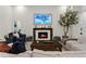 Cozy living room showcases a fireplace as its focal point and has wood-look floors at 1141 Waldorf Ct, Winter Springs, FL 32708