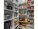 Well-organized walk-in pantry providing ample storage and easy access to food items at 1141 Waldorf Ct, Winter Springs, FL 32708