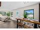Bright dining area with open layout and wood table, complemented by natural light and neutral decor at 124 Oak Ridge Ave, Edgewater, FL 32132