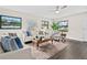 Comfortable living room showcasing ample natural light, neutral tones, and stylish contemporary furnishings at 124 Oak Ridge Ave, Edgewater, FL 32132