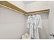 Functional walk-in closet with built-in wooden shelves and clothing rods, offering plenty of storage at 124 Oak Ridge Ave, Edgewater, FL 32132