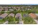Aerial view shows house, neighborhood, mature landscaping and manicured lawns at 13826 Mirror Lake Dr, Orlando, FL 32828