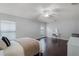 Spacious bedroom with hardwood floors, white walls, plenty of natural light, and a vanity area at 13826 Mirror Lake Dr, Orlando, FL 32828