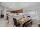 Cozy dining area connected to the kitchen with natural lighting and seating for Gathering meals at 13826 Mirror Lake Dr, Orlando, FL 32828