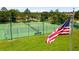 Community tennis courts with green surface are a great way to stay active at 13826 Mirror Lake Dr, Orlando, FL 32828