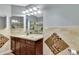 Bathroom features a vanity, sink, mirror, lighting fixtures and mosaic tiled walls at 151 E Washington St # 5B, Orlando, FL 32801