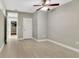 A bedroom with hardwood floors, neutral walls, and ample natural light at 151 E Washington St # 5B, Orlando, FL 32801