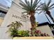 The Metropolitan at Lake Eola with lush tropical landscaping at the building's entrance at 151 E Washington St # 5B, Orlando, FL 32801