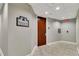 Hallway leading to Penthouse 5A and 5B with tile flooring and neutral walls at 151 E Washington St # 5B, Orlando, FL 32801
