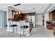 A spacious kitchen with stainless steel appliances, stylish pendant lighting, and a breakfast bar at 151 E Washington St # 5B, Orlando, FL 32801